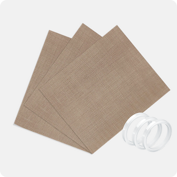 Three brown textured sheets with a white roll of tape on a light gray background