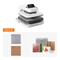 HTV Beginner Kit featuring a white and gray HTV cutter machine, a gray cutting mat, brown paper sheets, colorful vinyl sheets, a cutting guide, and loops, displayed on a clean white background.(EU)