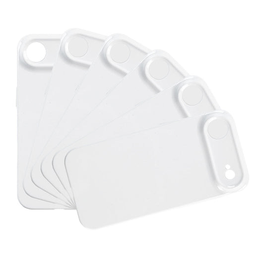 Set of white plastic cutting boards on a white background